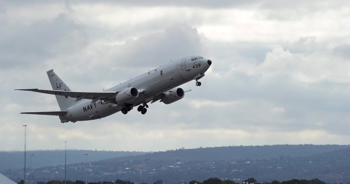 A U.S. Navy P-8 Poseidon aircraft flies out from Perth, Australia, International Airport Wednesday, April 16, 2014, to assist in the search for the missing Malaysia Airlines Flight 370 in the southern Indian Ocean. A robotic submarine looking for the lost Malaysian jet is continuing its second seabed search on as up to 14 planes were to take to the skies for some of the final sweeps of the Indian Ocean for floating debris from the ill-fated airliner. (AP Photo/Greg Wood, Pool)