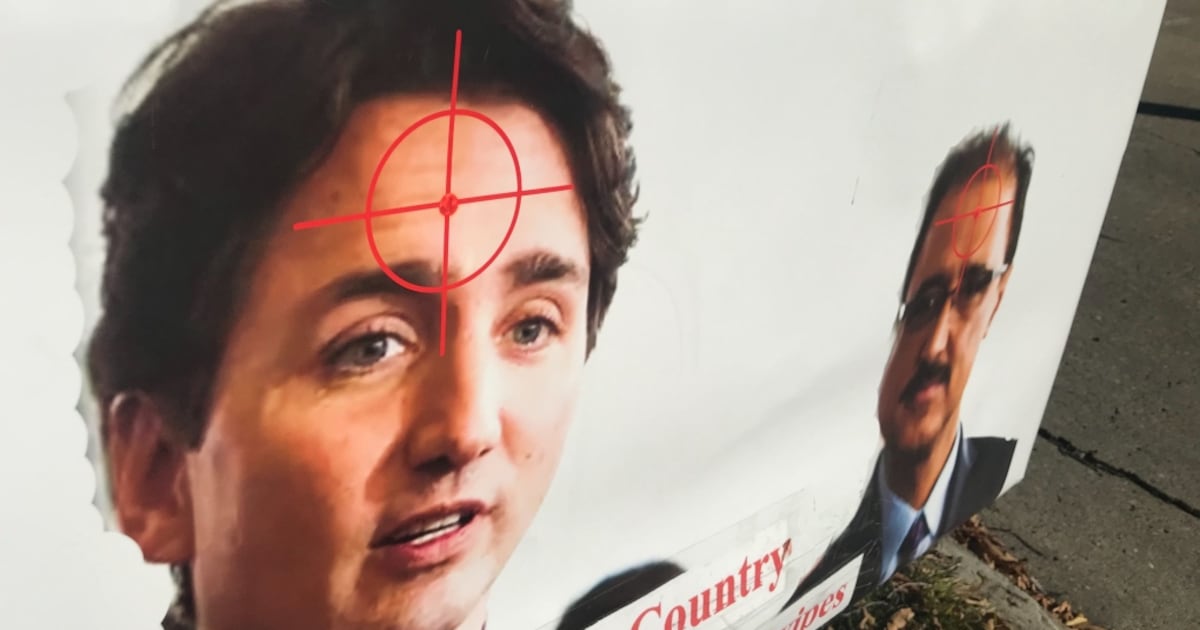 Sign Target Forhead Trudeau Edmonton lawn sign shows Trudeau with crosshair target on forehead