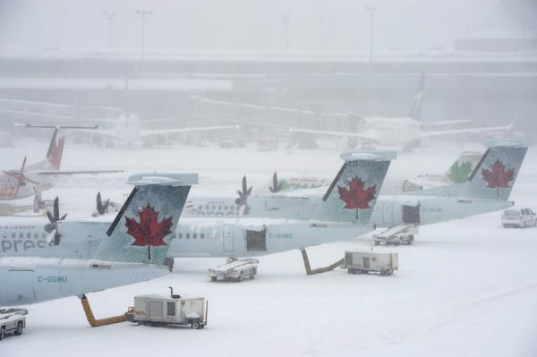 Most of Canada battles snowstorm that brings flights, schools to grinding halt