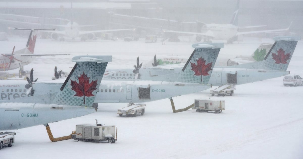 Most of Canada battles snowstorm that brings flights, schools to grinding halt