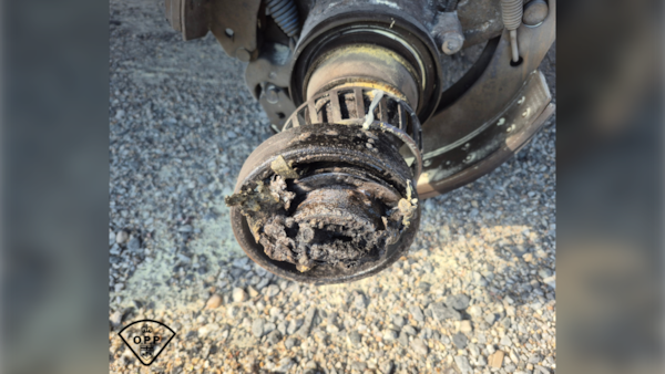 Trucking company, driver charged after transport wheels fly off on Hwy. 11