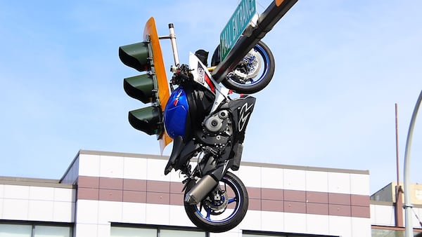 Motorcycle left dangling from traffic light pole after B.C. crash