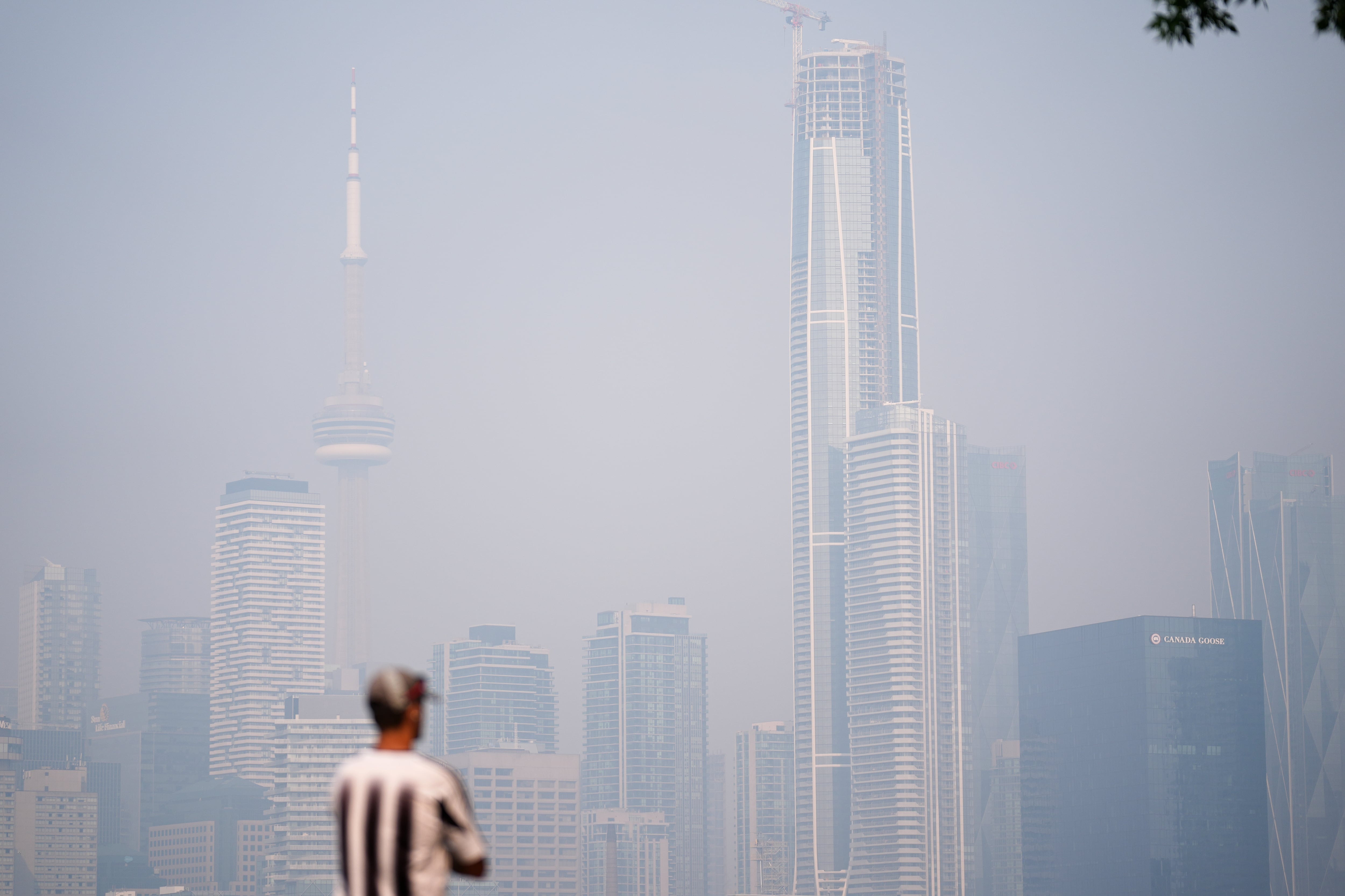 ‘A toxic cloud of pollutants’: Torontonians urged to stay inside as smoky c