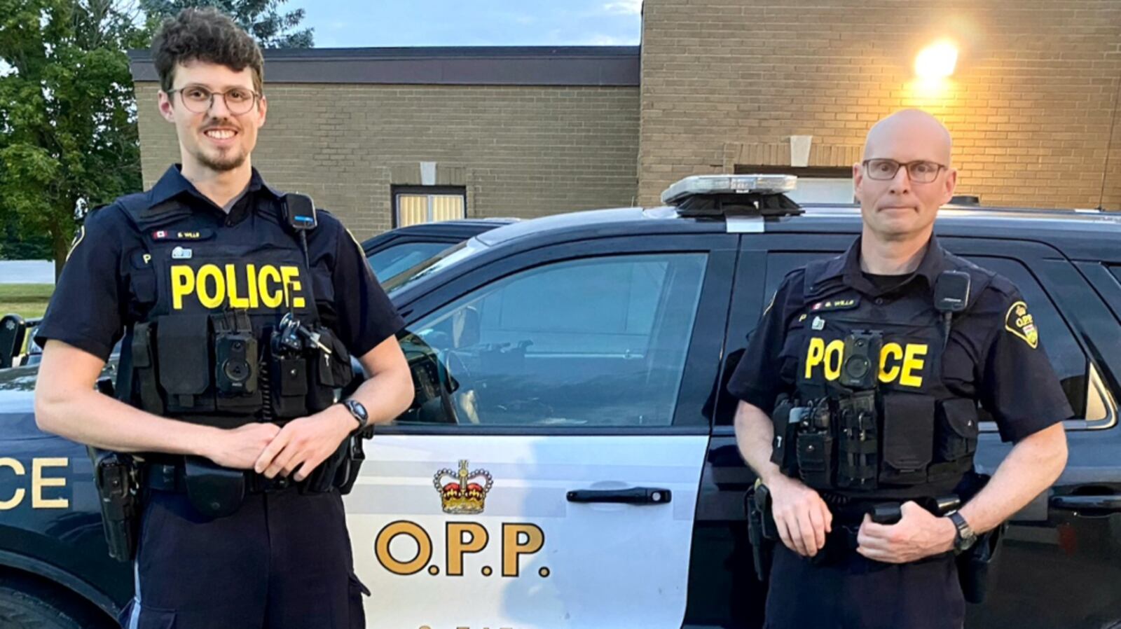 Opp Riot Team Son, father OPP officers team up for few nights to keep Frontenac safe