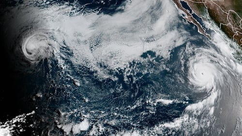 Major hurricane Genevieve roars in the Pacific as Hurricane Fausto nears Hawaii