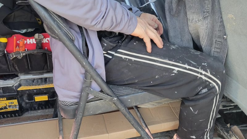 Passenger caught riding on fold‑up chair in back of cargo van, police say