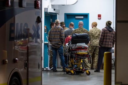 Emergency crews and military personnel at the Wainwright Health Centre as injured military members are treated after a fire at CFB Wainwright, outside of Wainwright, Alta., on Saturday, Oct. 17, 2026. THE CANADIAN PRESS/John Ulan