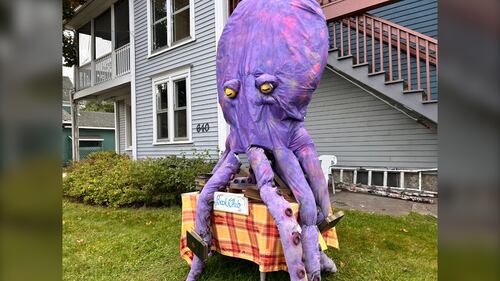 A purple octopus scarecrow is pictured.