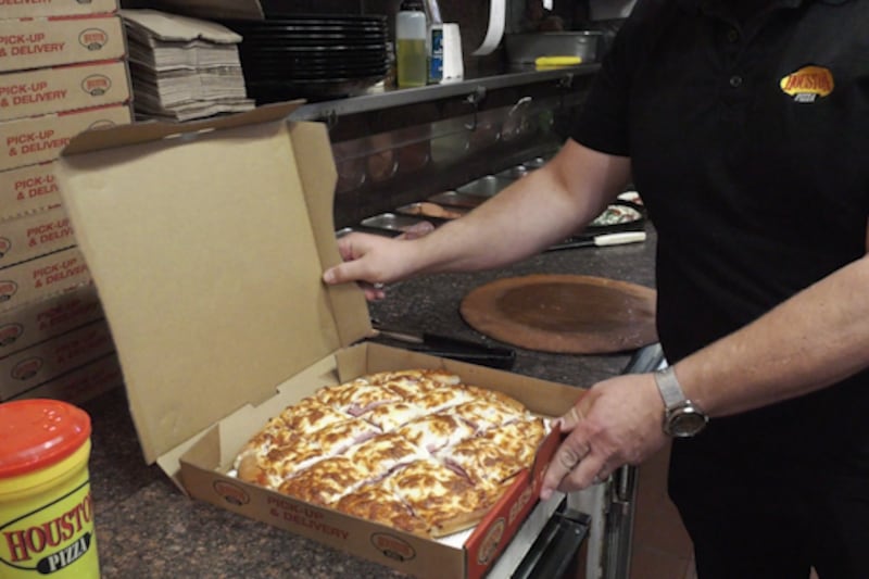What is the origin of Regina-style pizza?