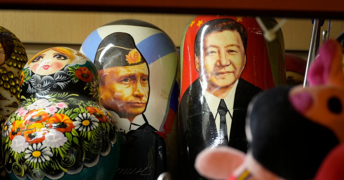 Traditional Russian wooden dolls called Matryoshka depicting Russian President Vladimir Putin and China's President Xi Jinping are displayed for sale at a souvenir shop in St. Petersburg, Russia, Monday, Feb. 24, 2025. (AP Photo/Dmitri Lovetsky)