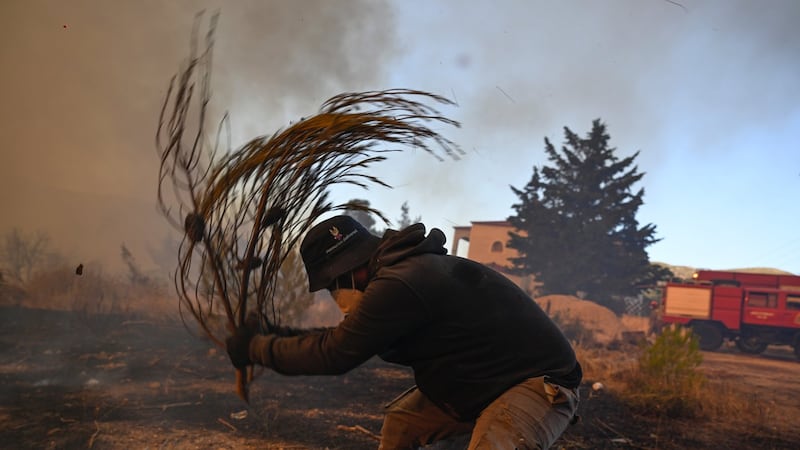 Greek wildfires halted after deadly helicopter crash; French evacuees returning home