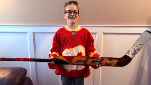 ‘Wolf, you are my idol’: Flames netminder gifts stick to 10-year-old fan in the stands