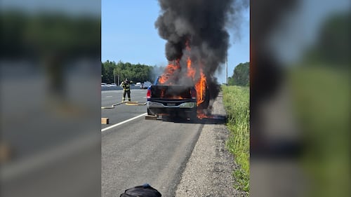 Truck goes up in flames along Hwy. 400, stranger steps in to help