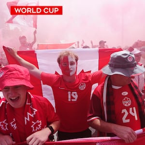 Canada fans march through the streets of Vancouver ahead of World Cup match against Qatar