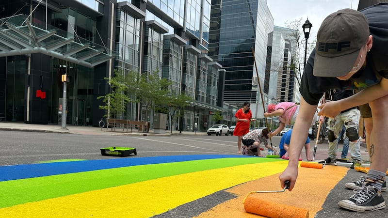 Regina volunteers kick-off pride month by painting LGBTQ+ crosswalk downtown