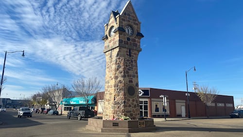 Flowers are seen at the Memorial Clock Tower on Main Street in Wainwright, Alta., on Oct. 19, 2026, two days after the deadly incident at the local Canadian Armed Forces base. (Darcy Seaton / CTV News Edmonton)