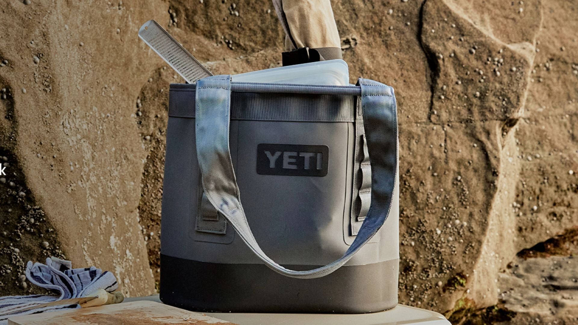 the beach bag on a rock at the beach