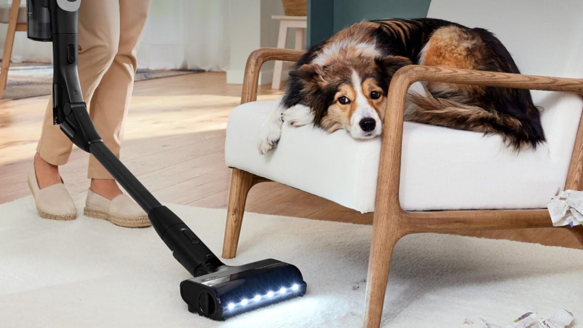 A person using the Bosch Unlimited 10 Cordless Stick Vacuum.