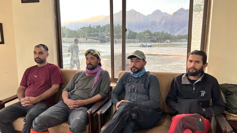 Pakistan teams search on foot for remains of climbers as weather grounds helicopters