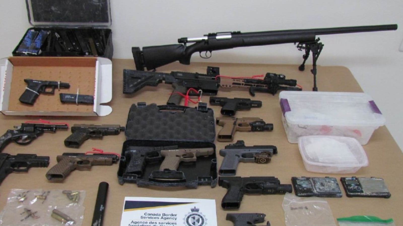 The CBSA says it searched a Vancouver home in August 2024 and uncovered six firearms, including a pair of 3D-printed “Glock-type” pistols and a semi-automatic rifle. (Handout)