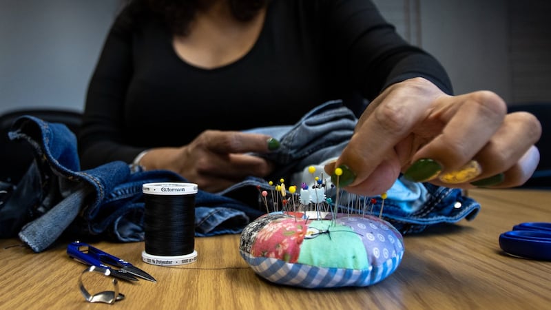 'Stitched it back': Edmonton event where locals mend clothes promotes sustainability