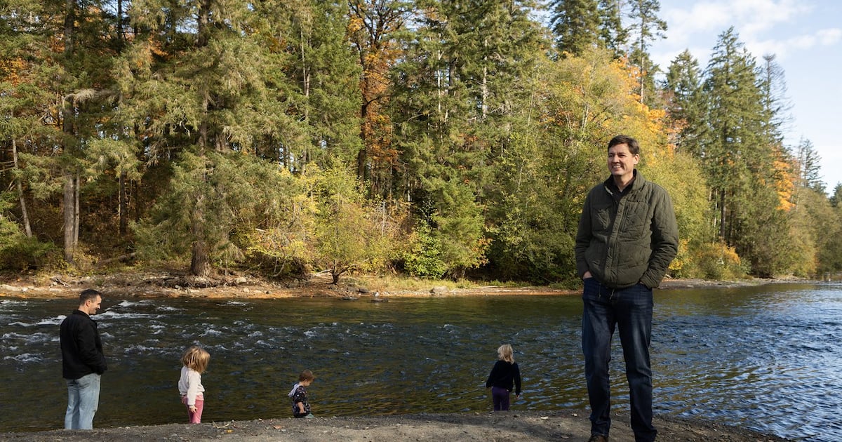 Photo: CTV News NDP Leader David Eby stands on the shore of the Puntledge river following an announcement in Courtenay, B.C., Saturday, Oct