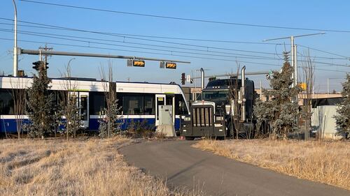 Crews and police respond to a morning crash between an LRT train and a semi-truck on Nov. 26, 2025. (Evan Klippenstein/CTV News Edmonton)