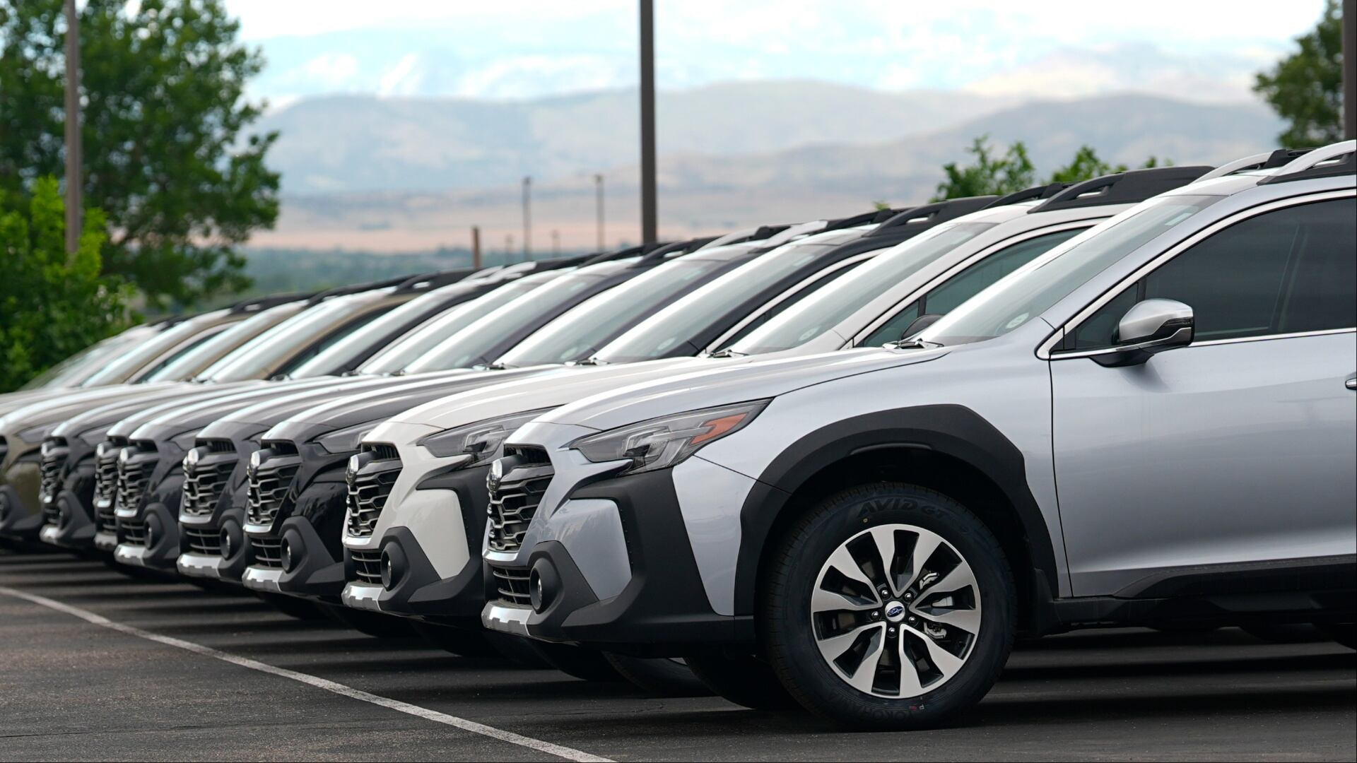 Unsold 2024 Outback wagons sit on the lot of a Subaru dealership Tuesday, June 25, 2024, in Loveland, Colo. (AP Photo/David Zalubowski)