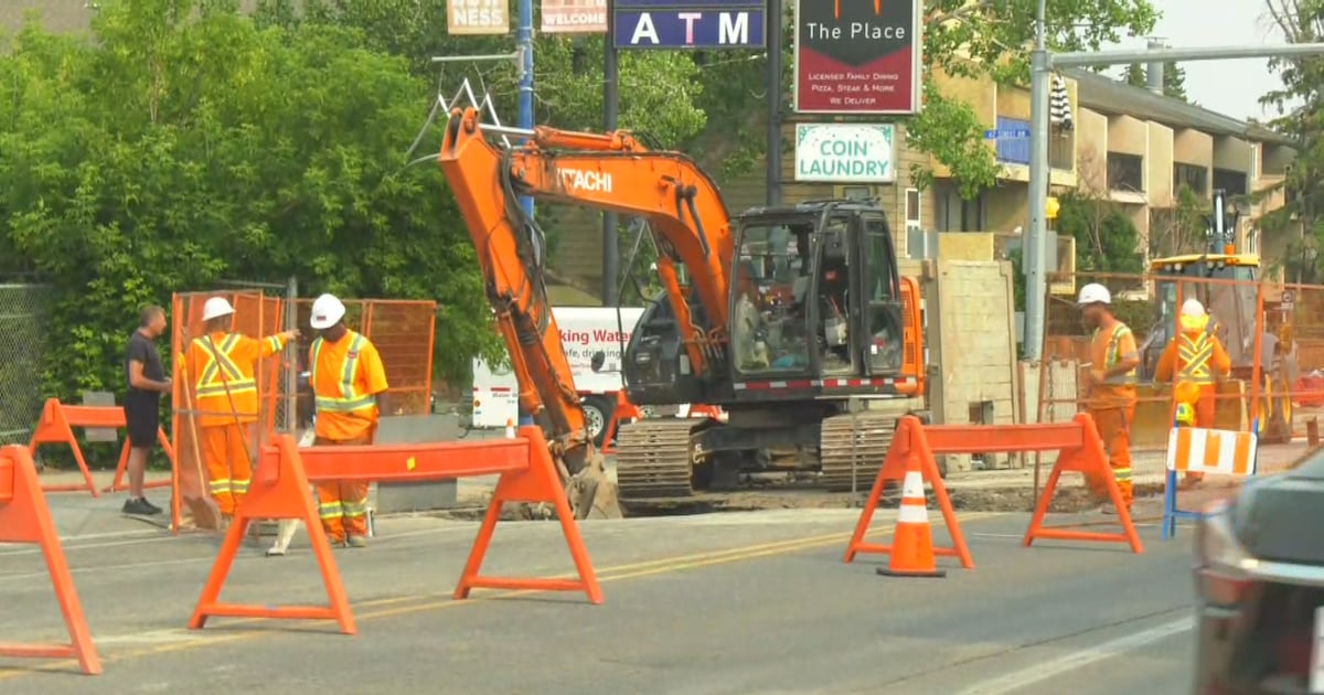 Photo: Ctvnews A City of Calgary crew works to repair a sinkhole after a water main break on the 6300 block of Bowness Road on Aug. 9