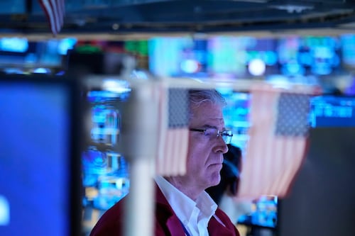 U.S. stocks hold near their records after oil prices swing lower