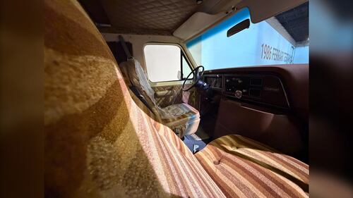The interior of a 1980s van is pictured.