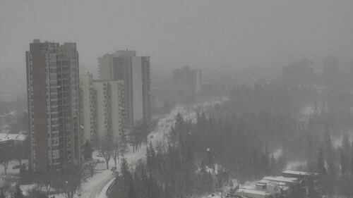 Snow obscures an aerial view of Edmonton during a storm on Feb. 17, 2026. (CTV News Edmonton)