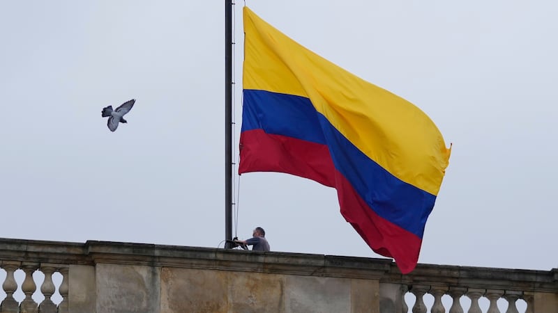 An explosive device kills 13 and injures 38 on a bus in southwestern Colombia as violence persists