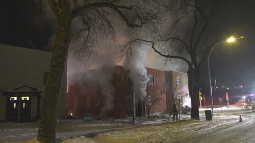 Smoke billows from 10328 97 Ave. in Edmonton the morning of Feb. 23, 2026. (Evan Klippenstein / CTV News Edmonton)