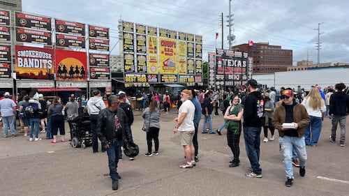 People stand in line for ribs.