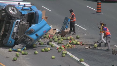 Watermelons scattered on roadway following tractor trailer crash on Hwy. 401 in Halton Hills