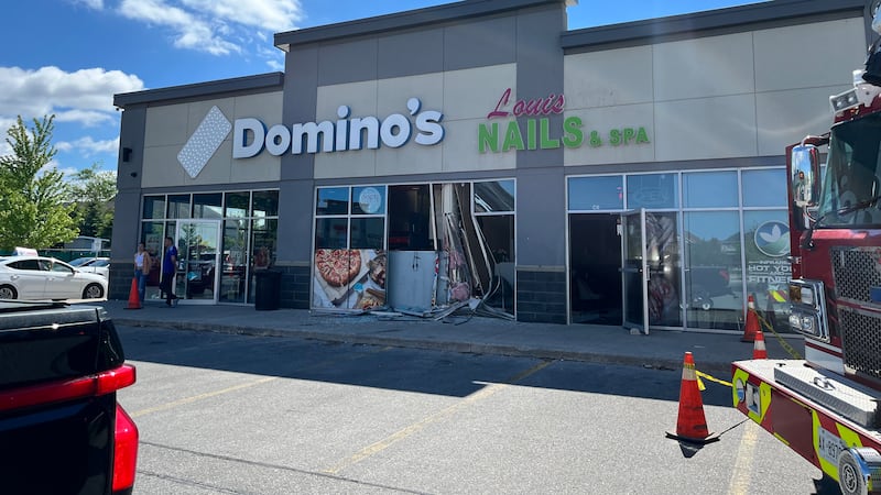 Vehicle reportedly smashes into Domino’s Pizza
