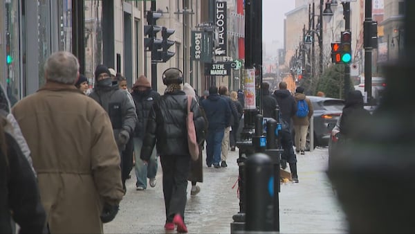 Last-minute shoppers help boost downtown retailers; merchants say REM is helping