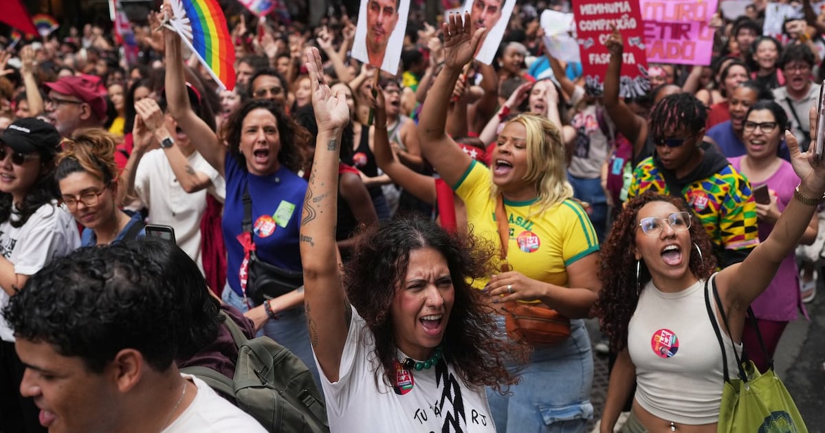 Students march to defend public education and support Brazilian President Luiz Inacio Lula da Silva, who is running for a fourth term, ahead of the presidential runoff election in Rio de Janeiro, Wednesday, Oct. 7, 2026. (AP Photo/Silvia Izquierdo)