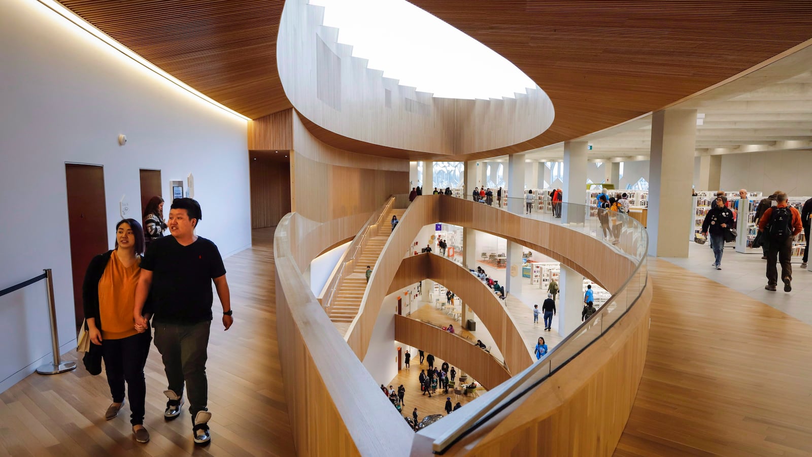 Calgary Library Statues Calgary Public Library hits historic milestone