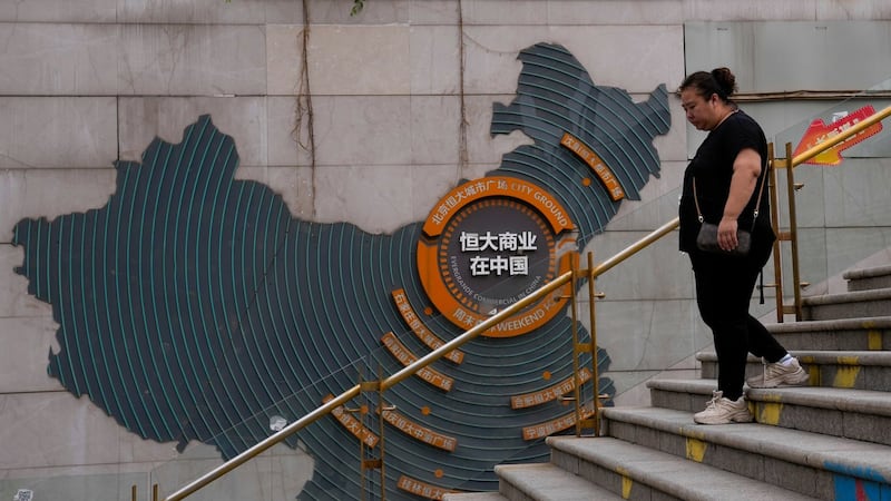 Chinese court sentences founder of troubled property developer Evergrande to life in prison