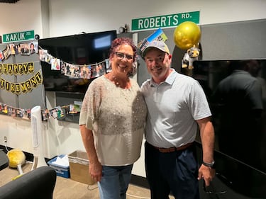 Jason Moore (right), former AM800 News Director stopped by to congratulate Patty and share memories. June 26, 2026 (Kristen Hazael/CTV News Windsor)