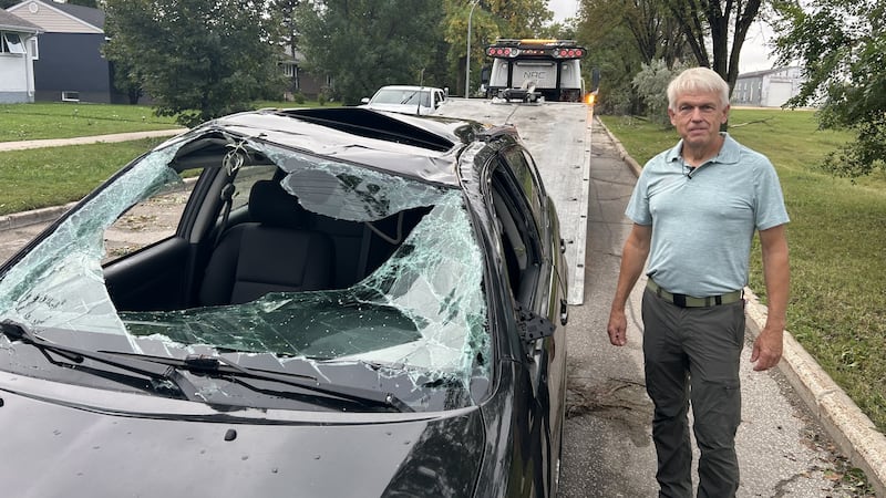 Storm hurls car onto lawn, thousands in Winnipeg without power