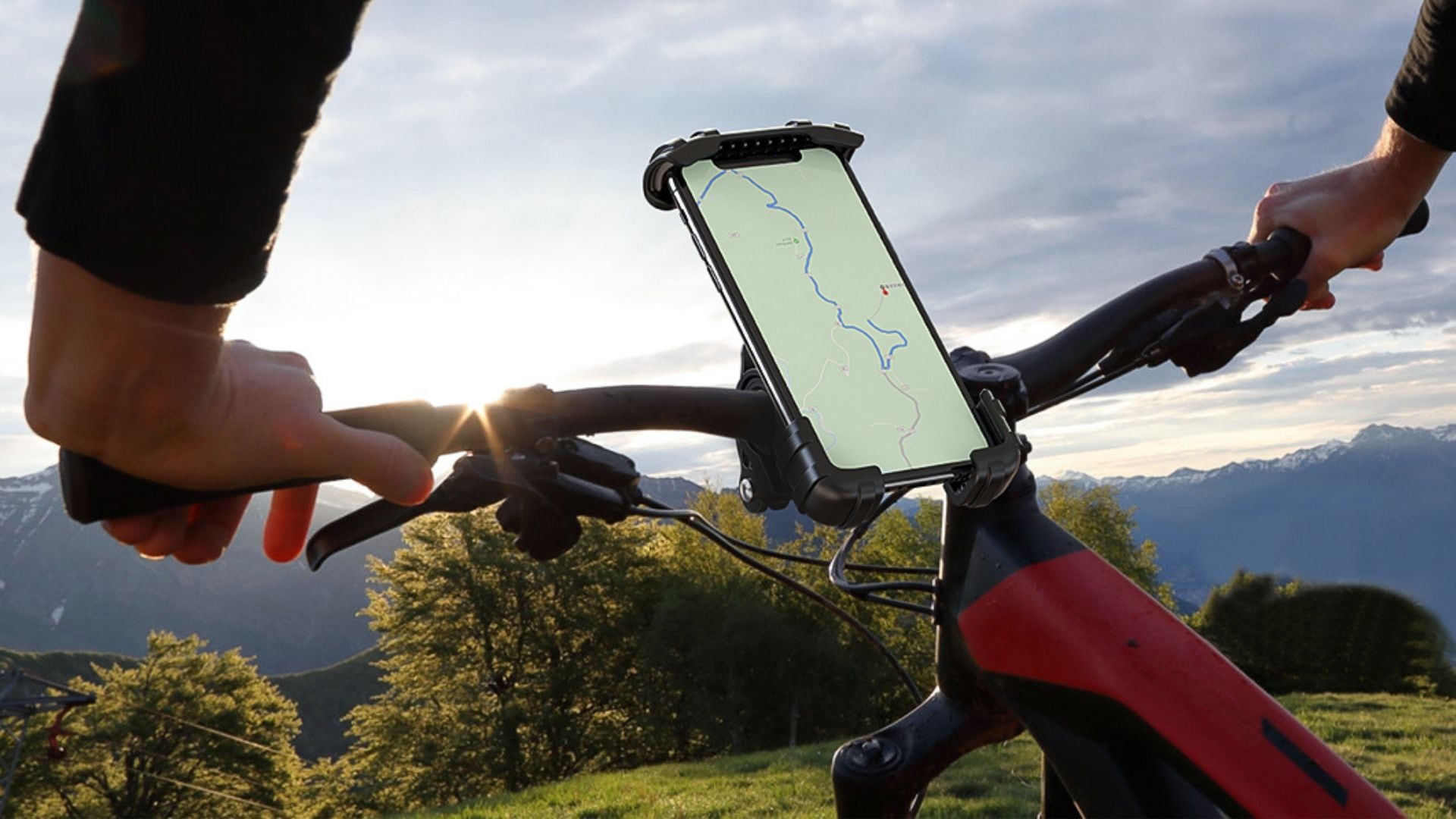 A Lamicall Bike Phone Mount on the handlebars of a red bike.