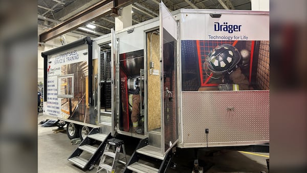 Sudbury fire students train in dark, confined trailer maze