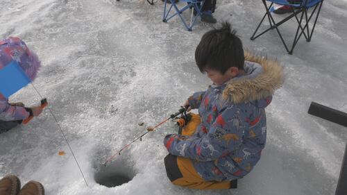 A child fishes at Wabamun Lake at the Kids Can Catch event at Wabamun Lake, Alta., on Feb. 14, 2026. (Galen McDougall / CTV News Edmonton)