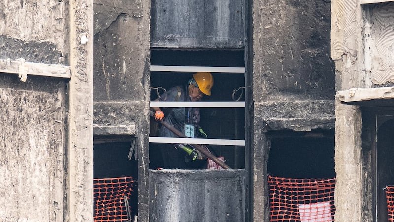 Grieving, traumatized survivors return to their homes 5 months after deadly Hong Kong fire