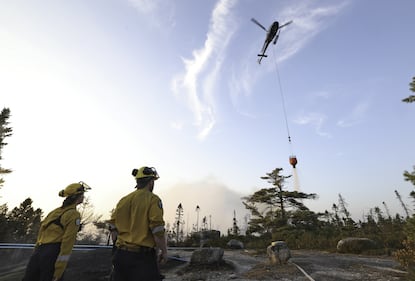 A helicopter drops water on the wildfire in the Bayers Lake area. (Source: Province of Nova Scotia)
