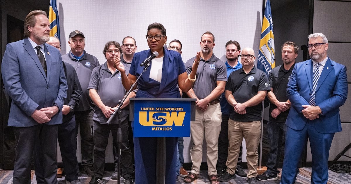 United Steelworkers (USW) International President Roxanne Brown, centre surrounded by union representatives addresses the escalating trade tensions between the United States and Canada during a press conference in Laval, Que., on Tuesday, Sept. 15, 2026. THE CANADIAN PRESS/Christinne Muschi