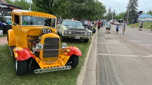 A yellow 1931 Ford Model A Victoria is pictured.